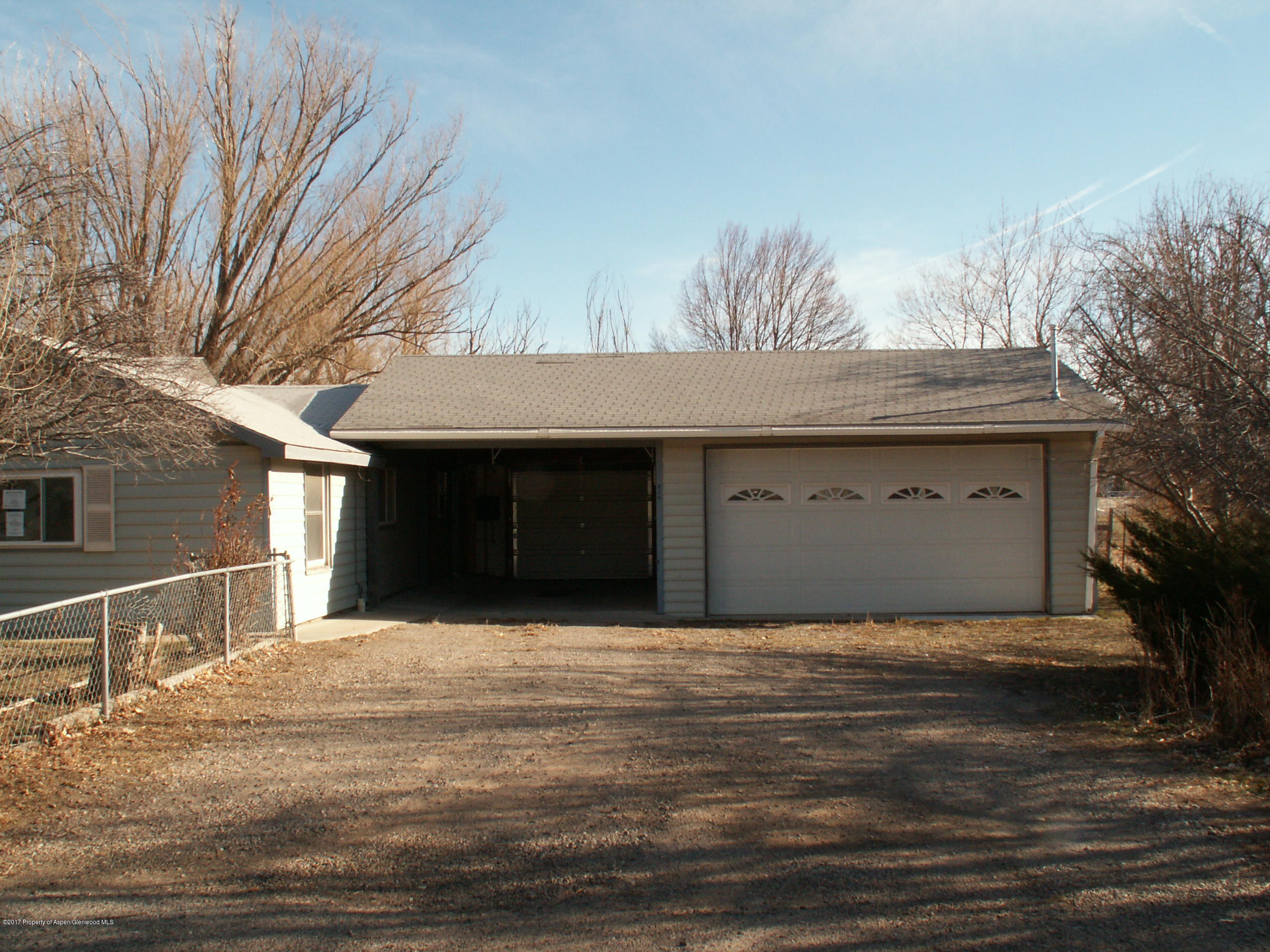 826 Randolph Avenue Rifle, CO 81650 - Photo 4 of 21 a front view of a house with a garage