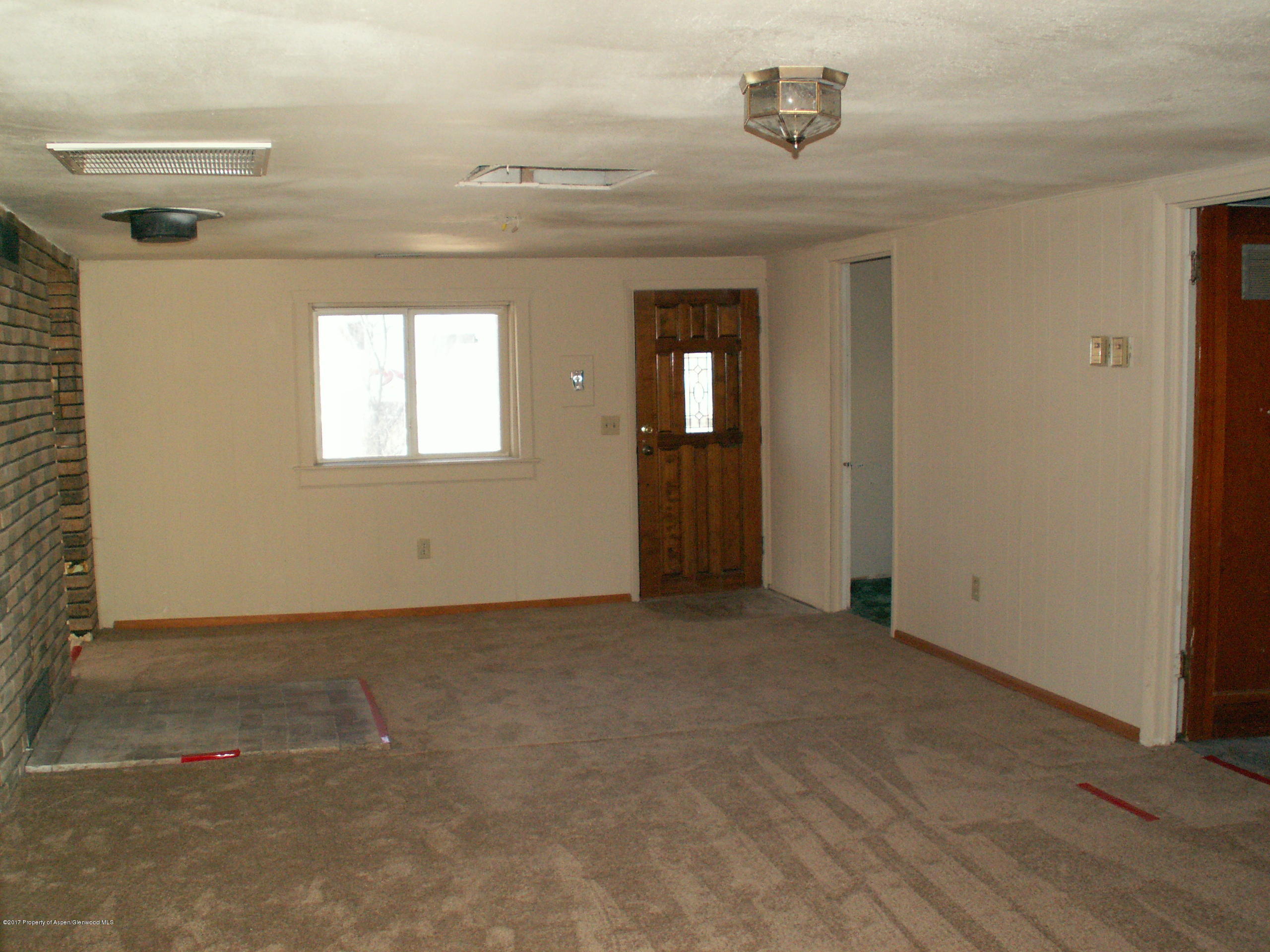 826 Randolph Avenue Rifle, CO 81650 - Photo 8 of 21 an empty room with windows