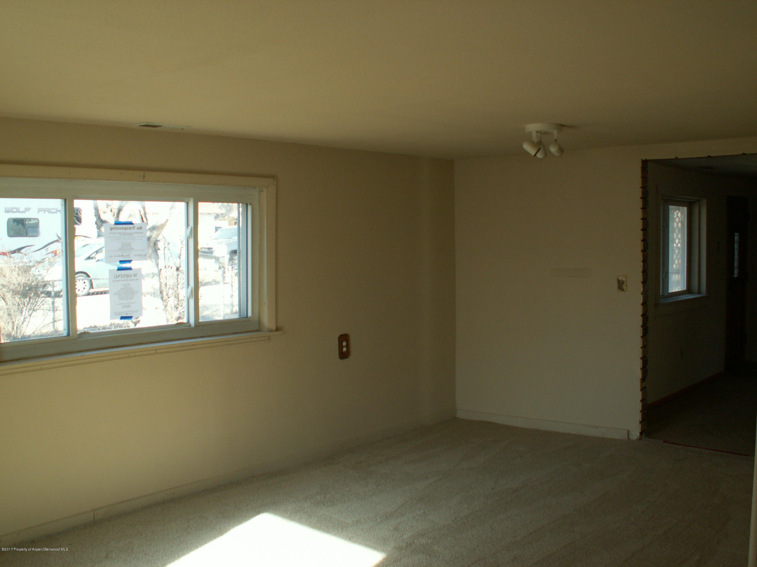 826 Randolph Avenue Rifle, CO 81650 - Photo 9 of 21 an empty room with a window