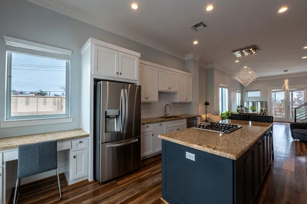a kitchen with a stove a refrigerator a sink and dishwasher