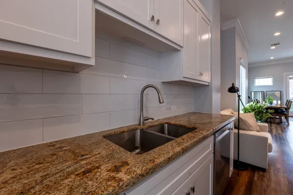 a kitchen with a sink and cabinets