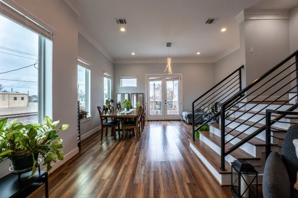 a view of a dining room with furniture window and wooden floor