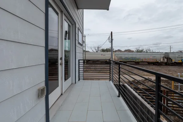 a view of a balcony with an outdoor space