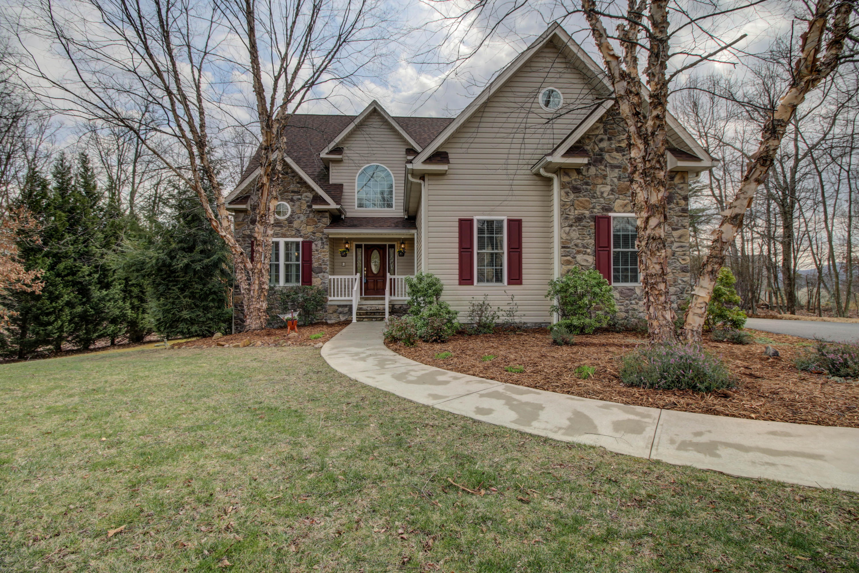 80 Cobblestone Drive Blue Ridge, VA 24064 - Photo 2 of 59 a front view of a house with a yard and garage