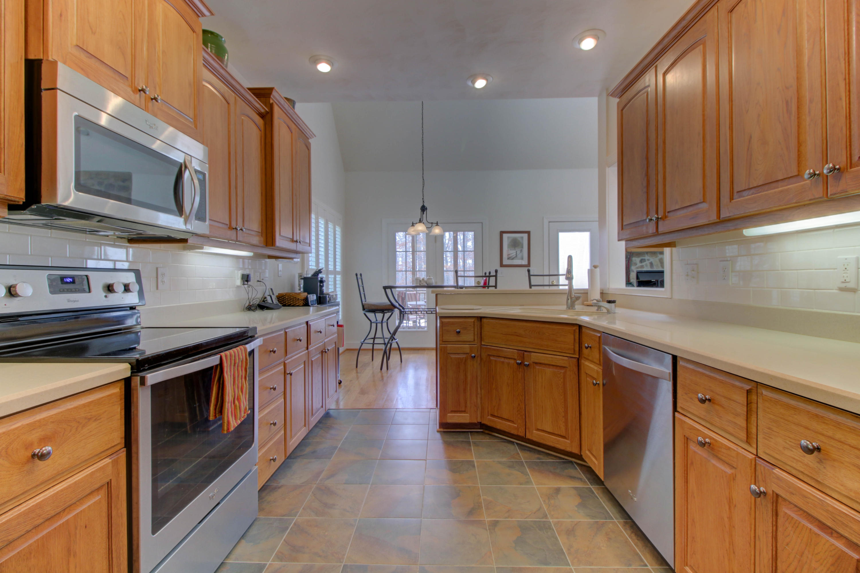 80 Cobblestone Drive Blue Ridge, VA 24064 - Photo 12 of 59 a kitchen with stainless steel appliances granite countertop a stove a sink and a microwave