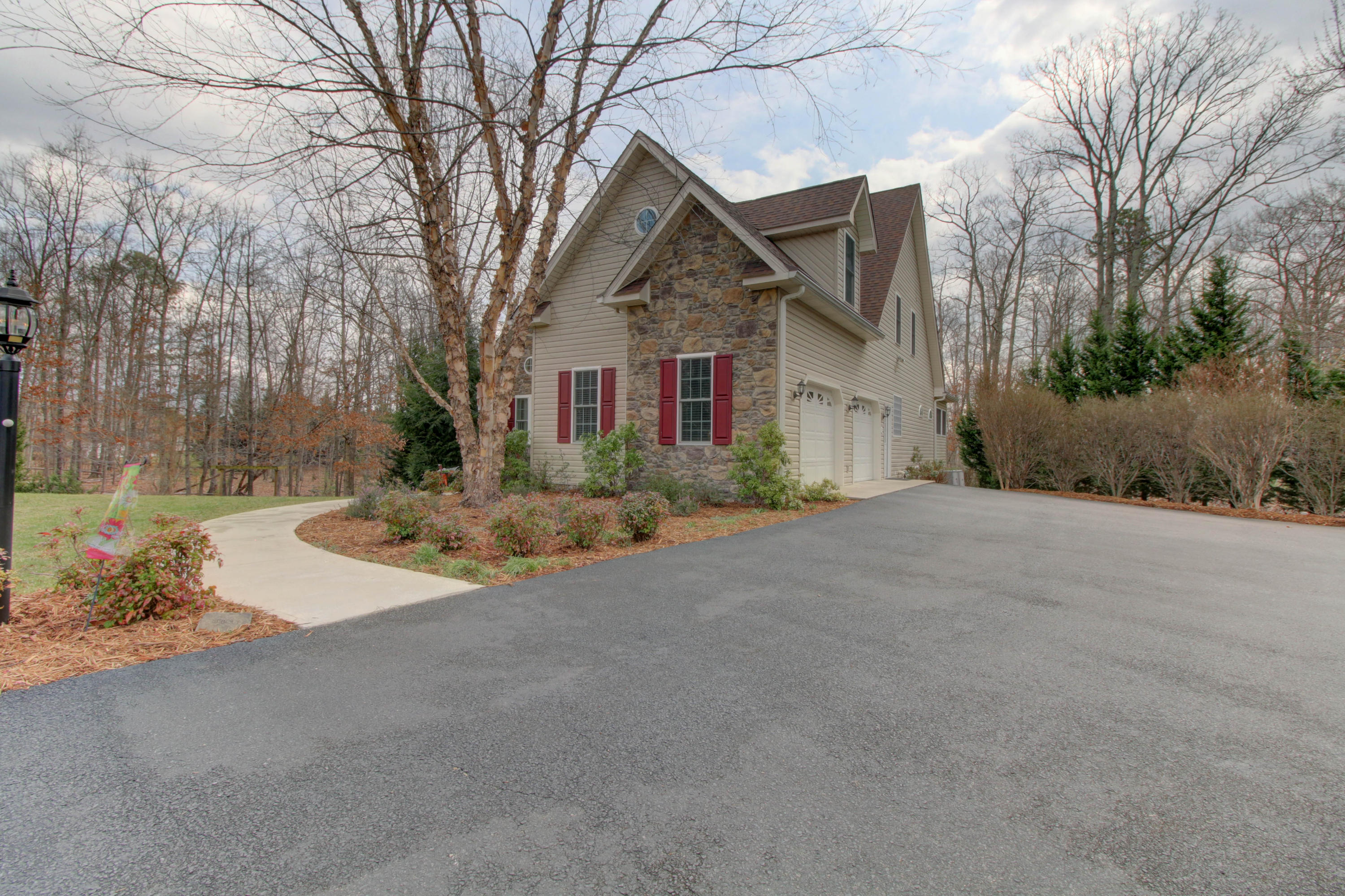 80 Cobblestone Drive Blue Ridge, VA 24064 - Photo 4 of 59 a view of a house with a yard and large tree