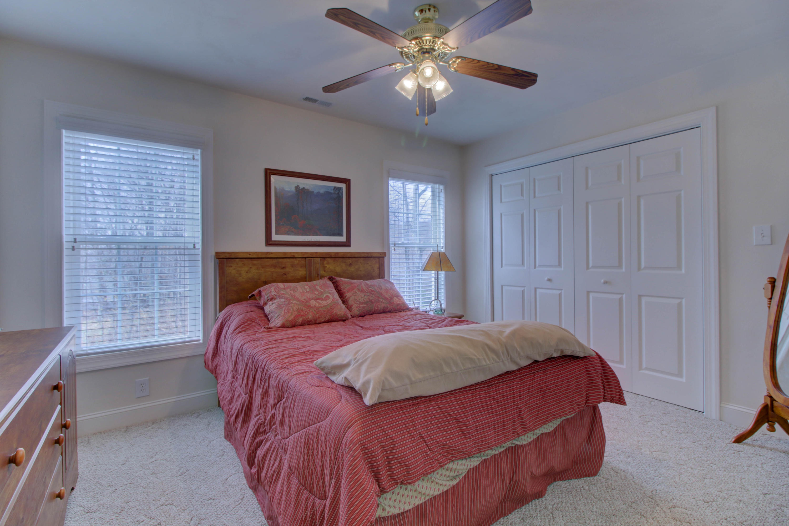 80 Cobblestone Drive Blue Ridge, VA 24064 - Photo 37 of 59 a bedroom with a bed and a chandelier