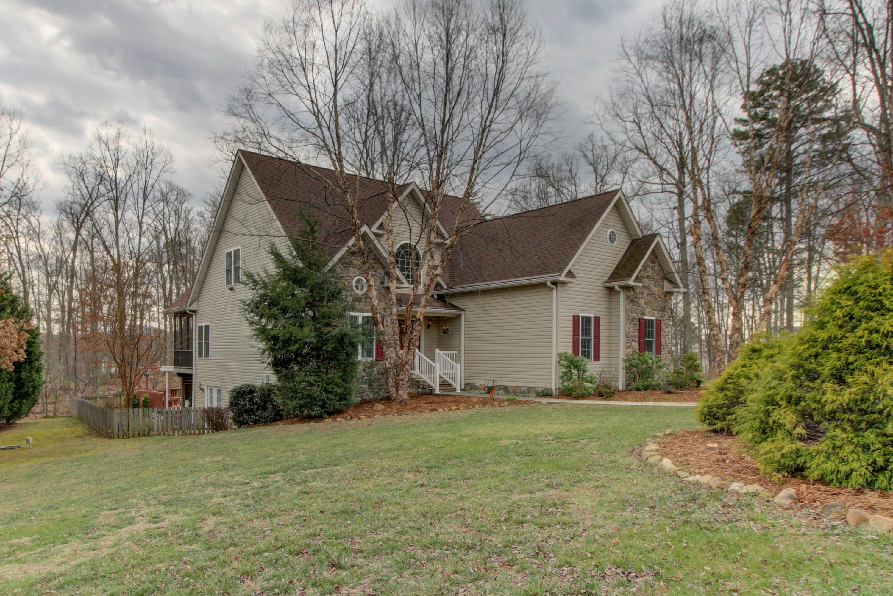 80 Cobblestone Drive Blue Ridge, VA 24064 - Photo 58 of 59 a view of a house with yard and a tree