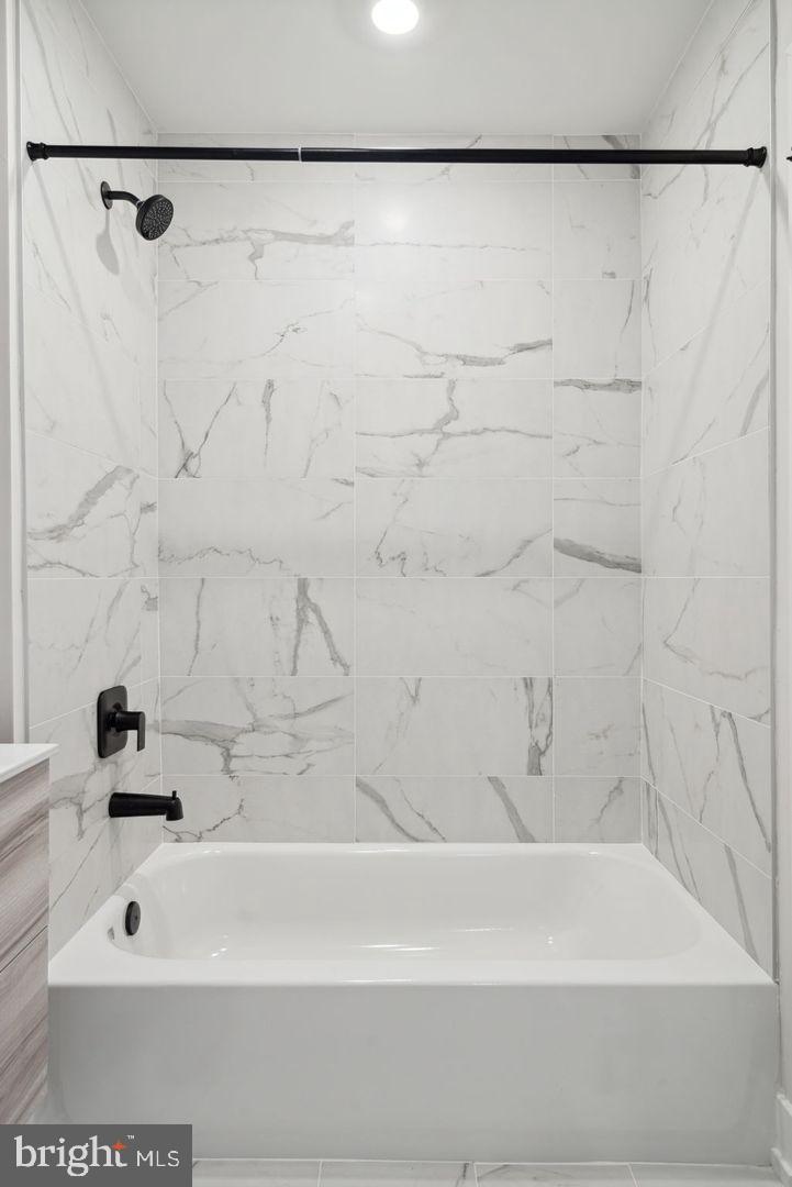 720 West Thompson Street, Unit 2B316 Philadelphia, PA 19122 - Photo 12 of 32 a bathroom with a shower and a bath tub