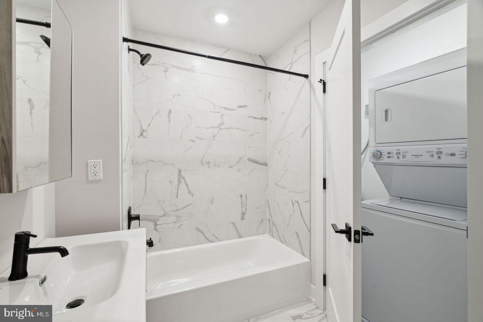 720 West Thompson Street, Unit 2B316 Philadelphia, PA 19122 - Photo 13 of 32 a bathroom with a tub and a shower