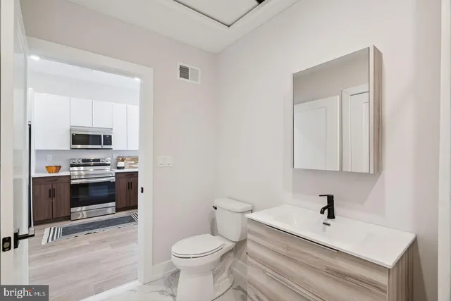 a bathroom with a toilet a sink and a bathtub