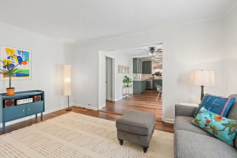 a bedroom with furniture and a wooden floor