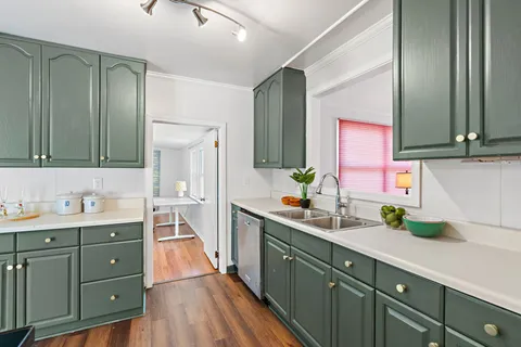 a bathroom with a double vanity sink mirror and double