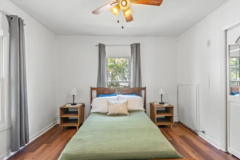 a bedroom with furniture and a window