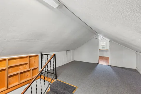 a view of an empty room with stairs