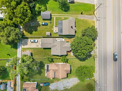 an aerial view of a house with outdoor space