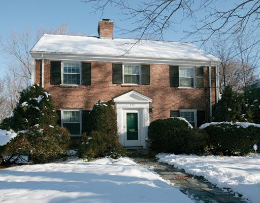 197 Reservoir Road Brookline, MA 02467 - Photo 1 of 2 a front view of a house with a yard and garage