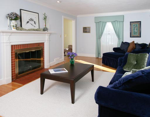 197 Reservoir Road Brookline, MA 02467 - Photo 2 of 2 a living room with furniture and a fireplace