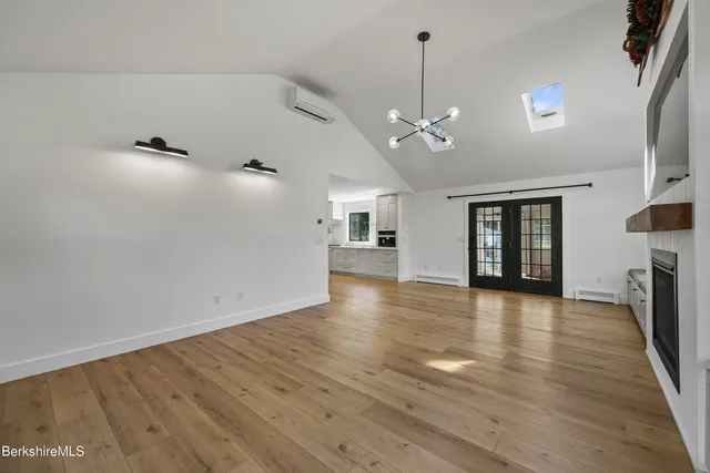 a view of a hallway with window and stairs