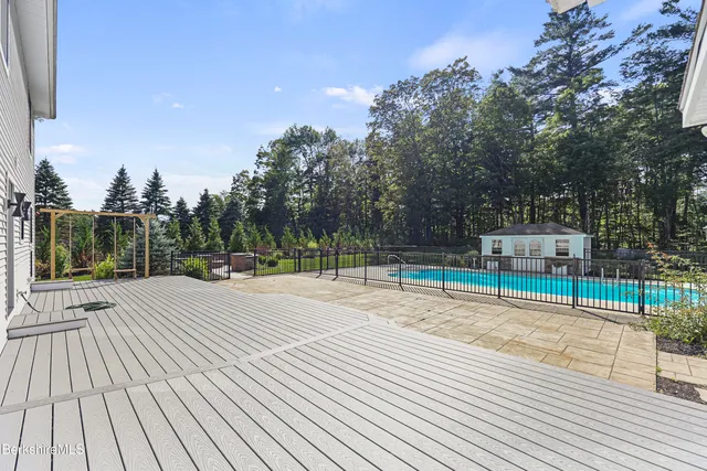 a backyard of a house with lots of green space and plants