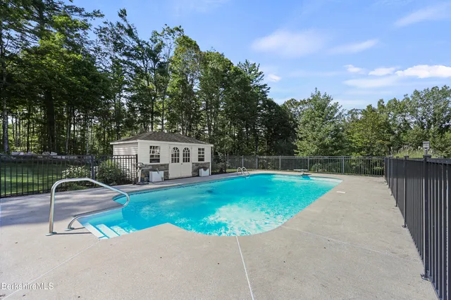 an aerial view of a houses with a yard