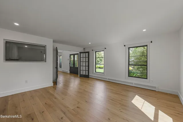 a large kitchen with a lot of counter space and stainless steel appliances