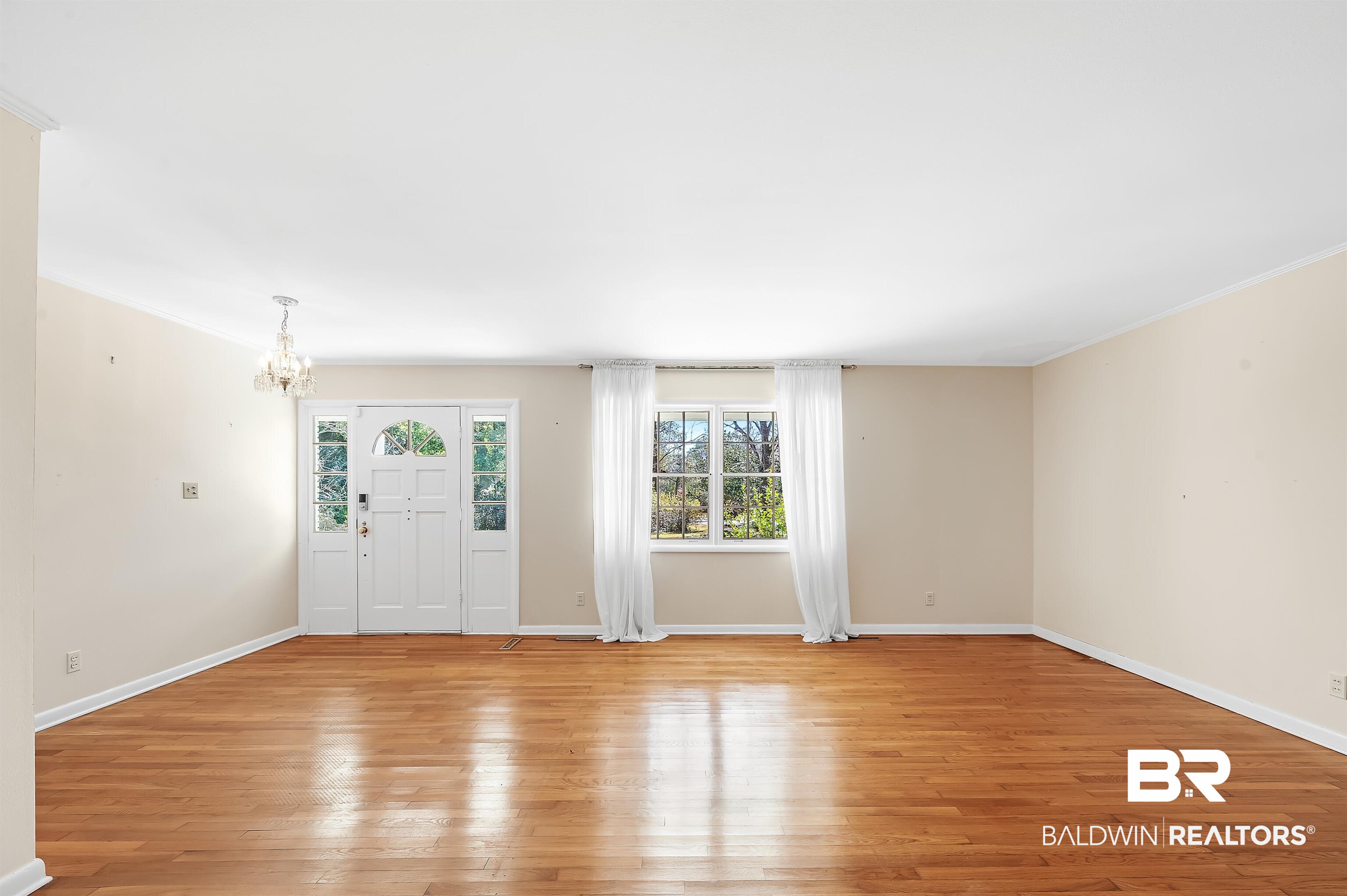 14375 Oak Street Magnolia Springs, AL 36555 - Photo 6 of 20 Interior space featuring a chandelier and oak hardwood floor