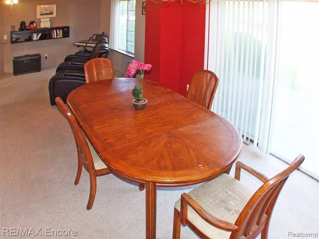 Spacious dining area open to living room and door to patio