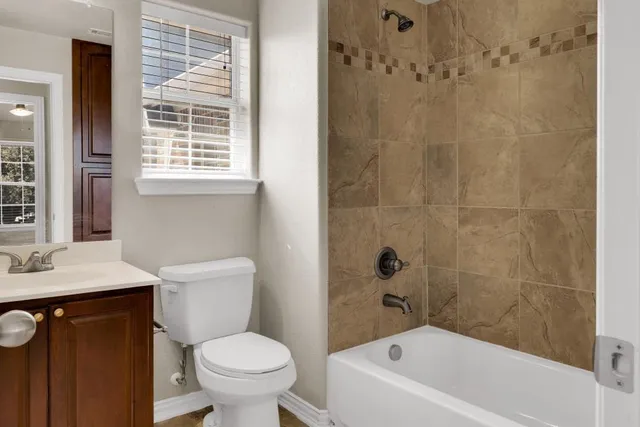 a bathroom with a sink a toilet and a bathtub