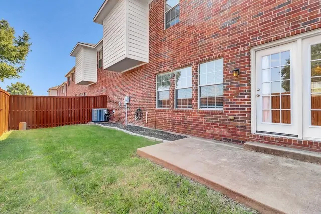 a front view of a house with a yard and a garage