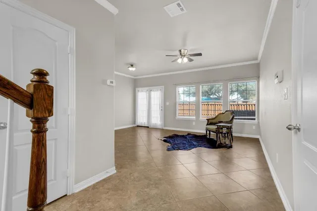 a view of a livingroom with furniture and a window