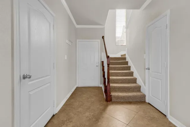 a view of entryway with stairs