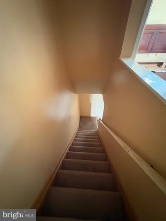 a view of a hallway with washer and dryer