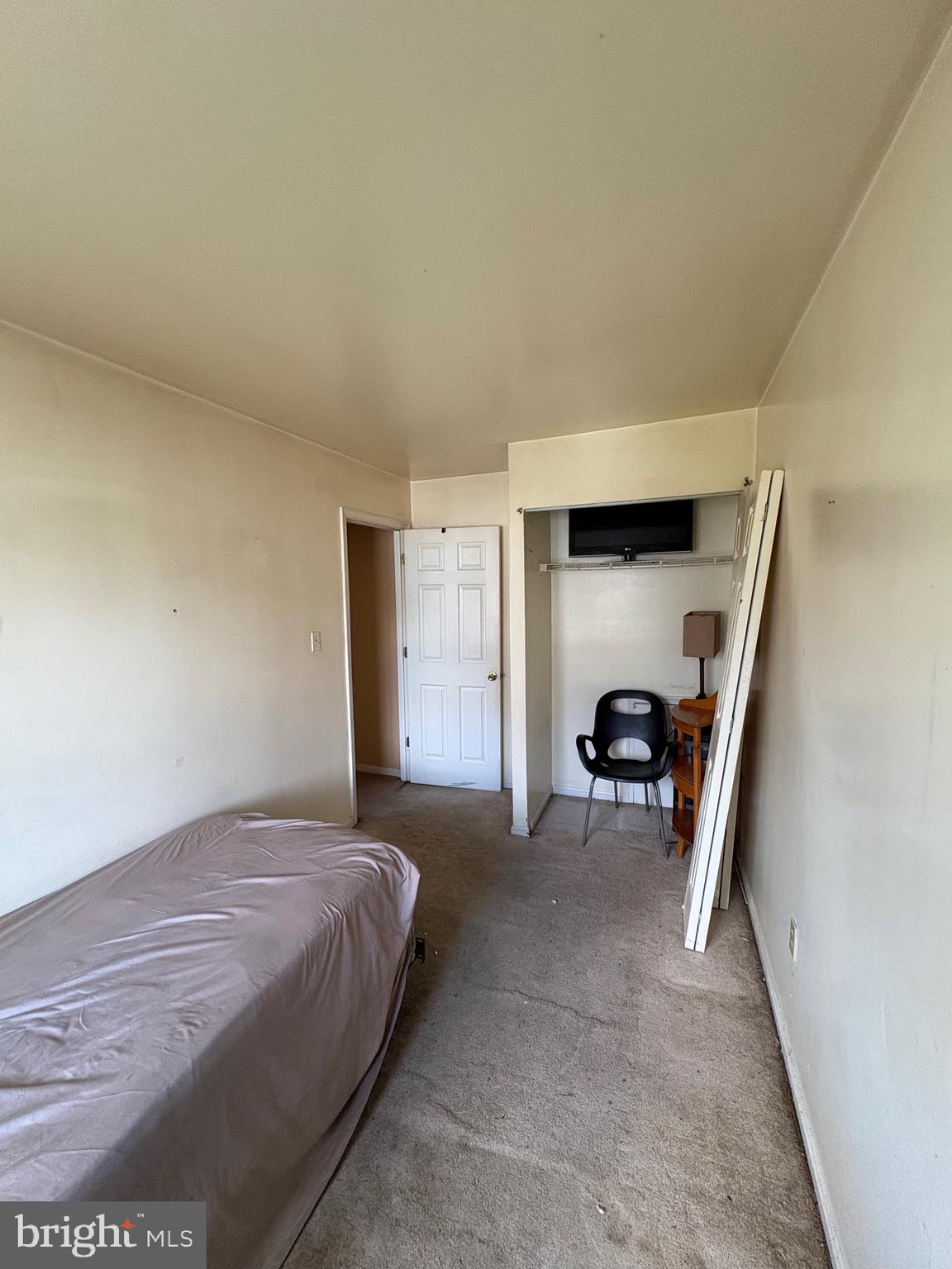 3071 Heath Cote Road Waldorf, MD 20602 - Photo 20 of 21 a bedroom with a bed and a chair