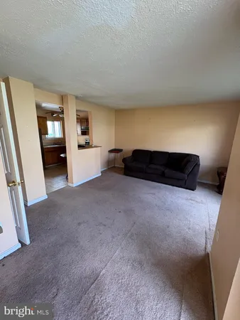 a kitchen with a sink appliances and cabinets