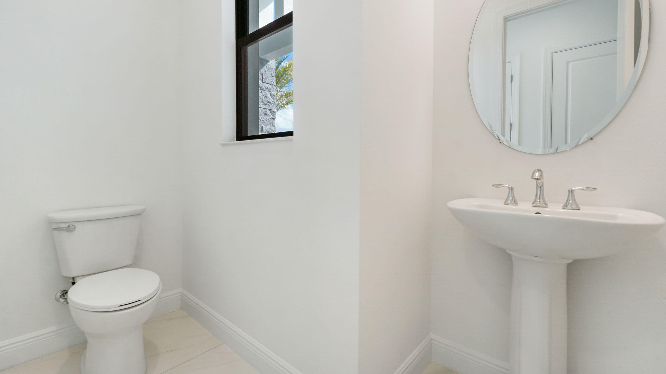 15739 Cresswind Place Westlake, FL 33470 - Photo 14 of 48 a bathroom with a sink a mirror and toilet