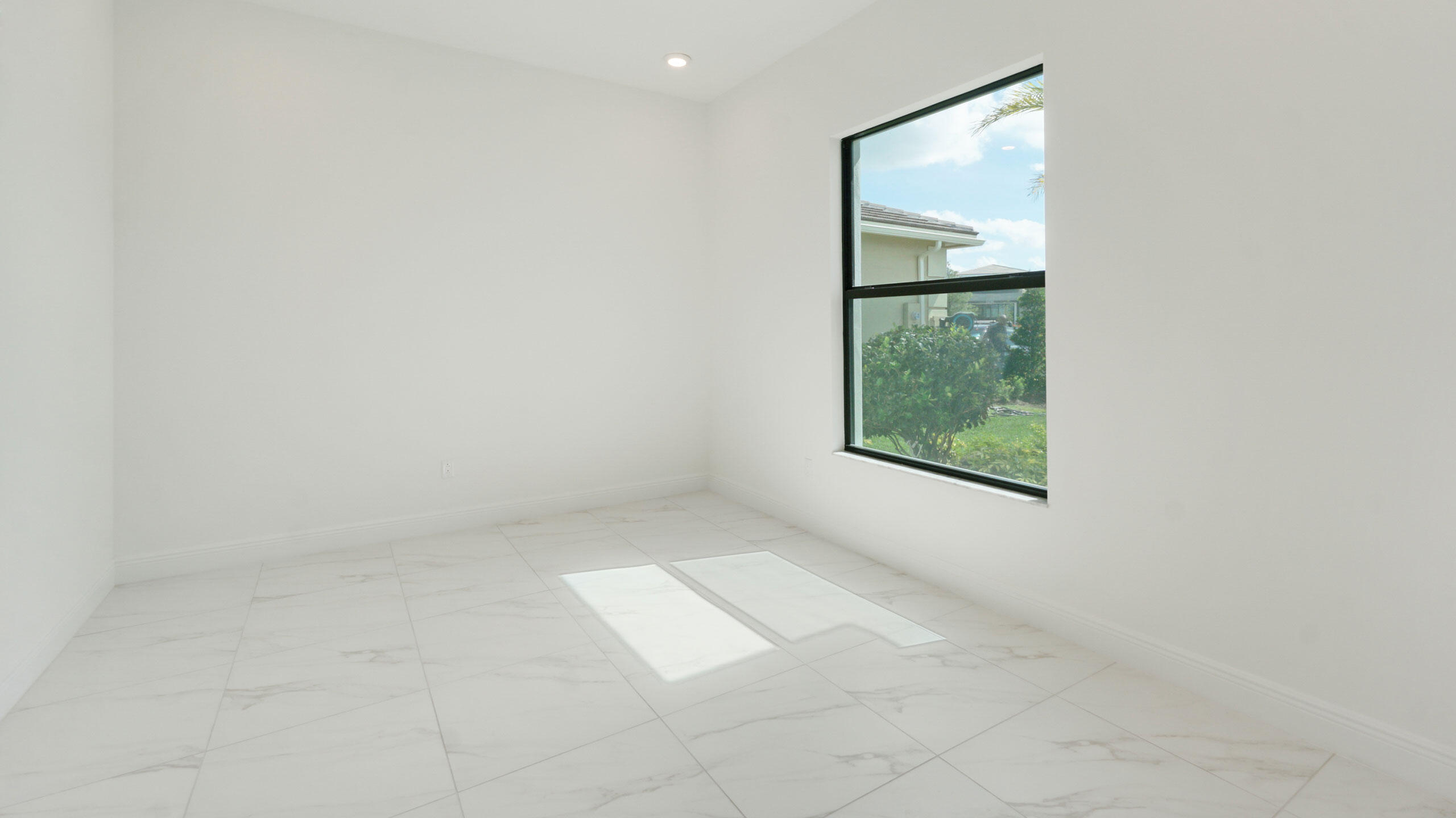 15739 Cresswind Place Westlake, FL 33470 - Photo 16 of 48 an empty room with windows and closet