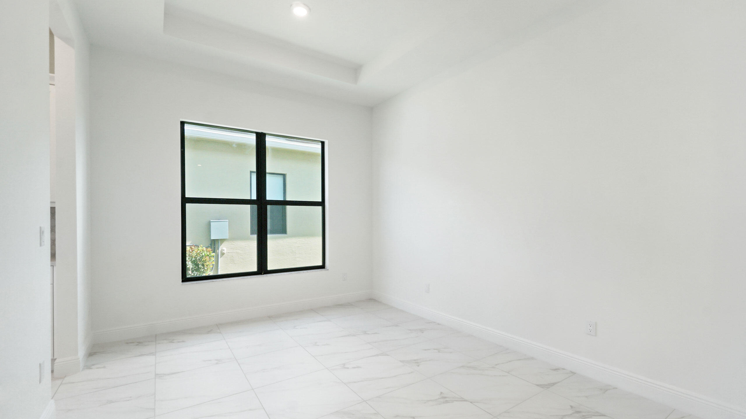 15739 Cresswind Place Westlake, FL 33470 - Photo 17 of 48 an empty room with windows and closet