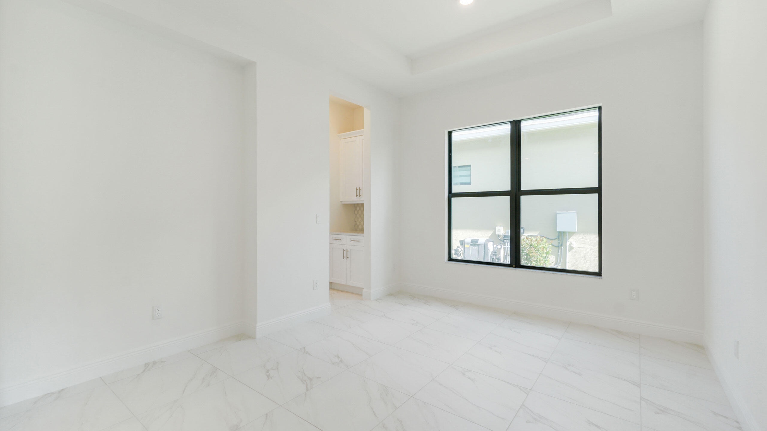 15739 Cresswind Place Westlake, FL 33470 - Photo 18 of 48 an empty room with windows and closet