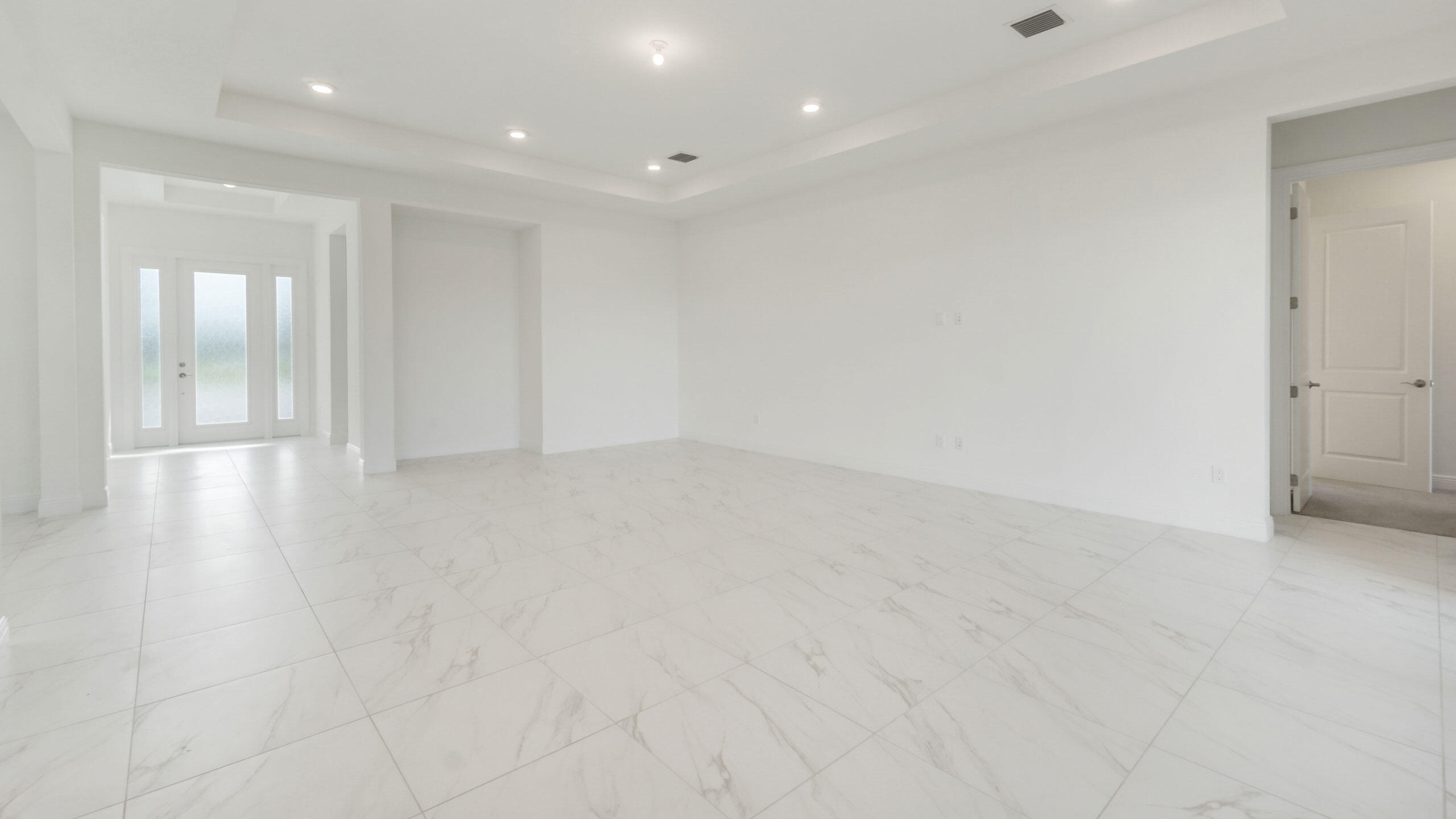 15739 Cresswind Place Westlake, FL 33470 - Photo 21 of 48 an empty room with wooden floor and windows