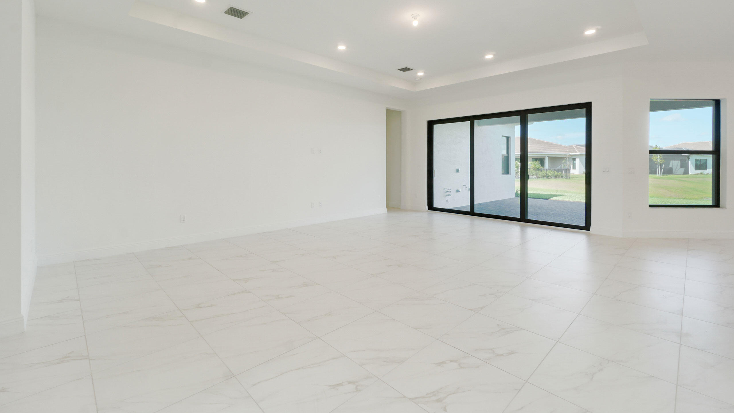 15739 Cresswind Place Westlake, FL 33470 - Photo 24 of 48 an empty room with windows and closet