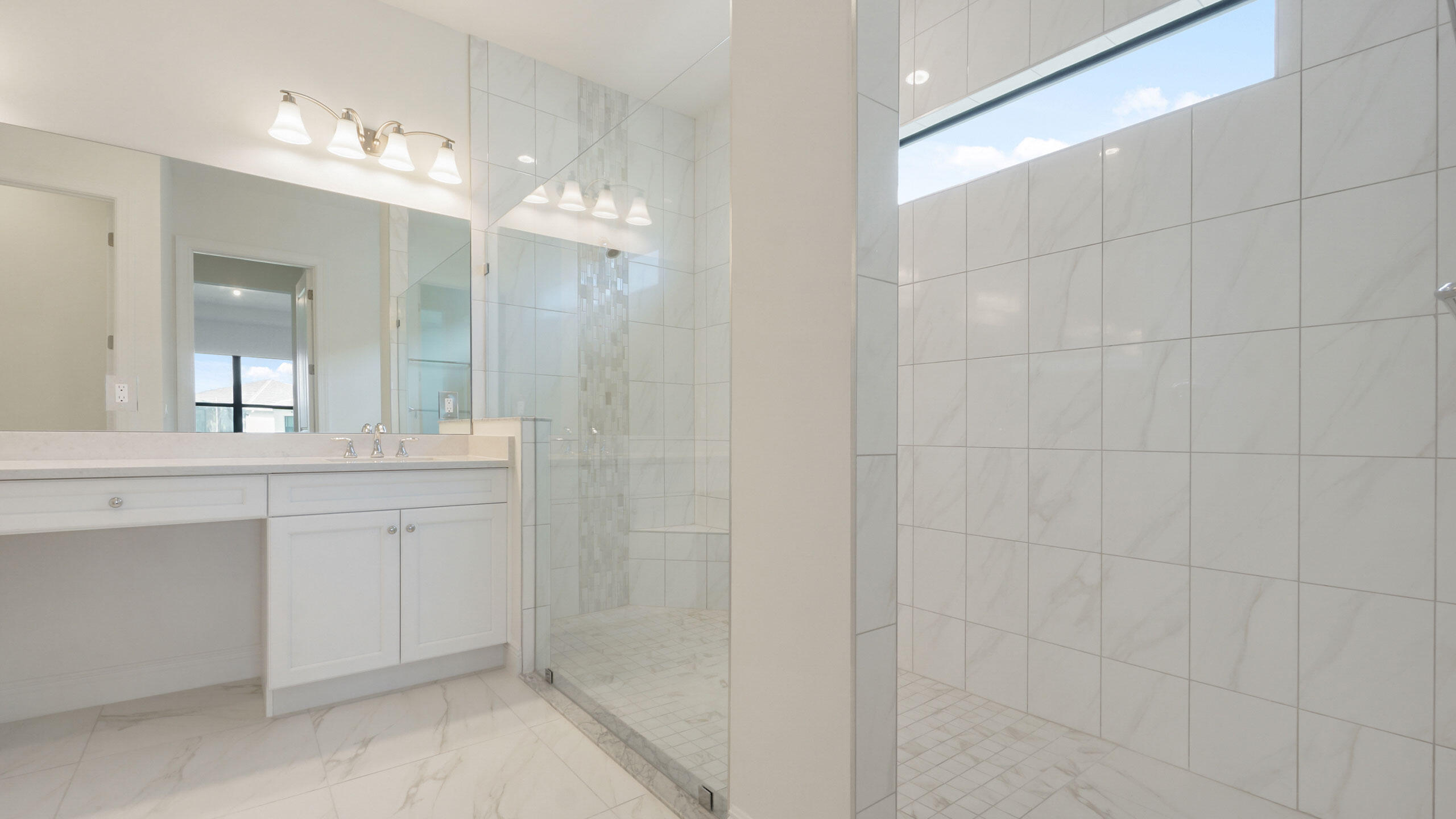 15739 Cresswind Place Westlake, FL 33470 - Photo 26 of 48 a bathroom with a double vanity sink mirror and shower