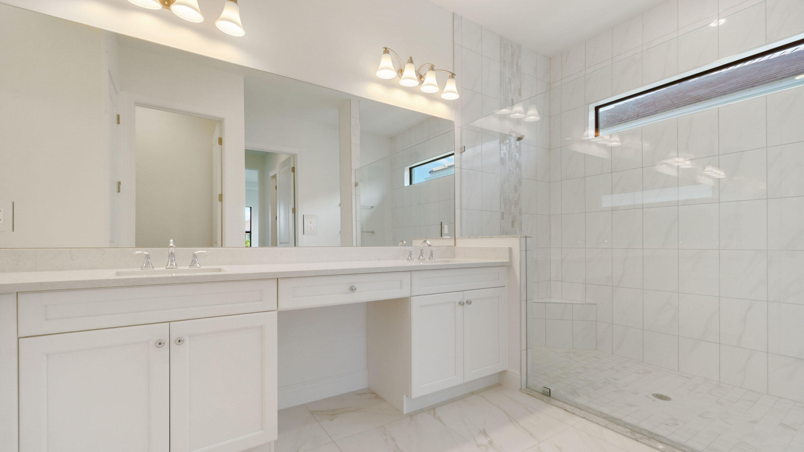 15739 Cresswind Place Westlake, FL 33470 - Photo 28 of 48 a bathroom with a sink and a mirror