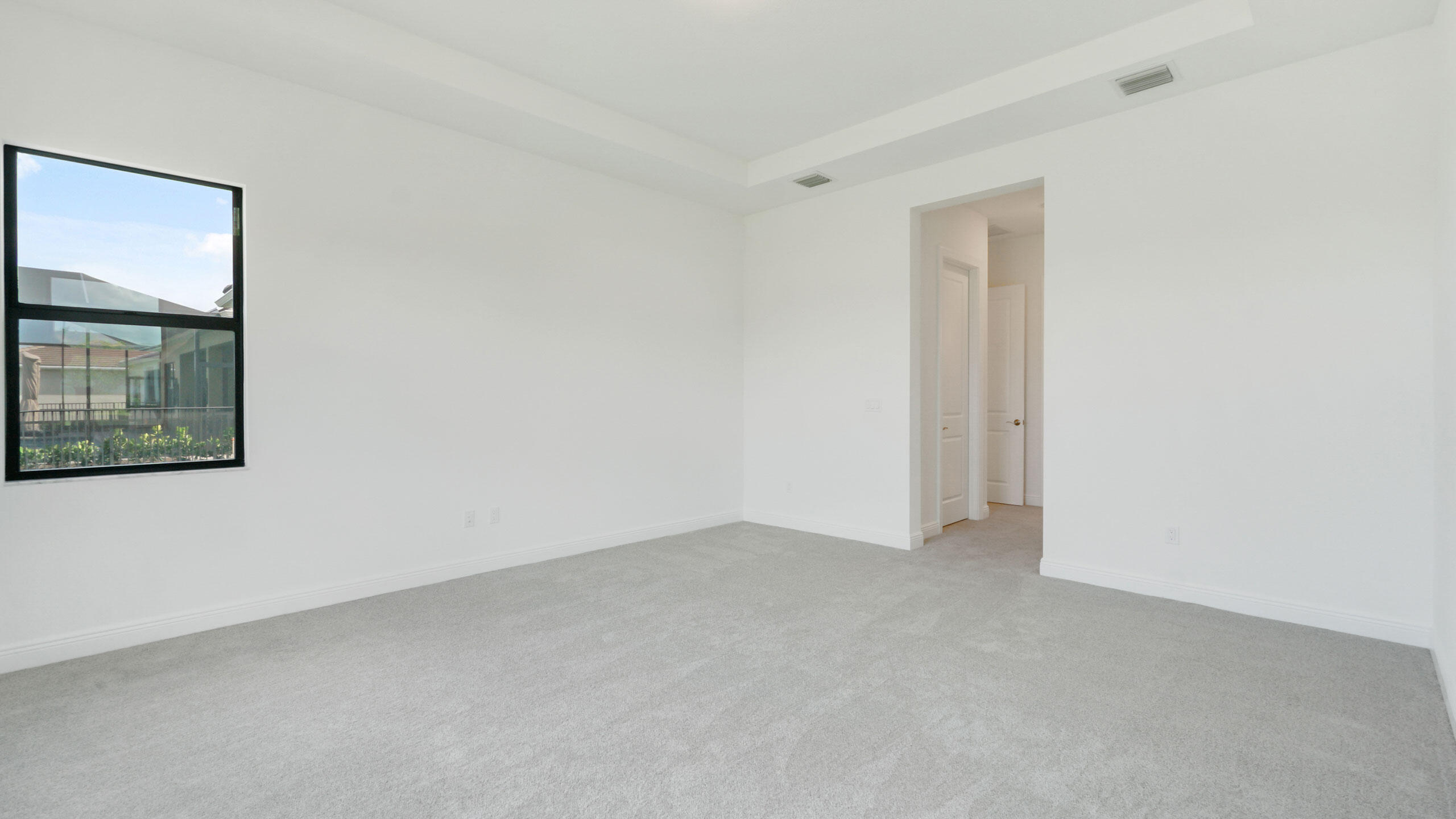 15739 Cresswind Place Westlake, FL 33470 - Photo 30 of 48 an empty room with windows