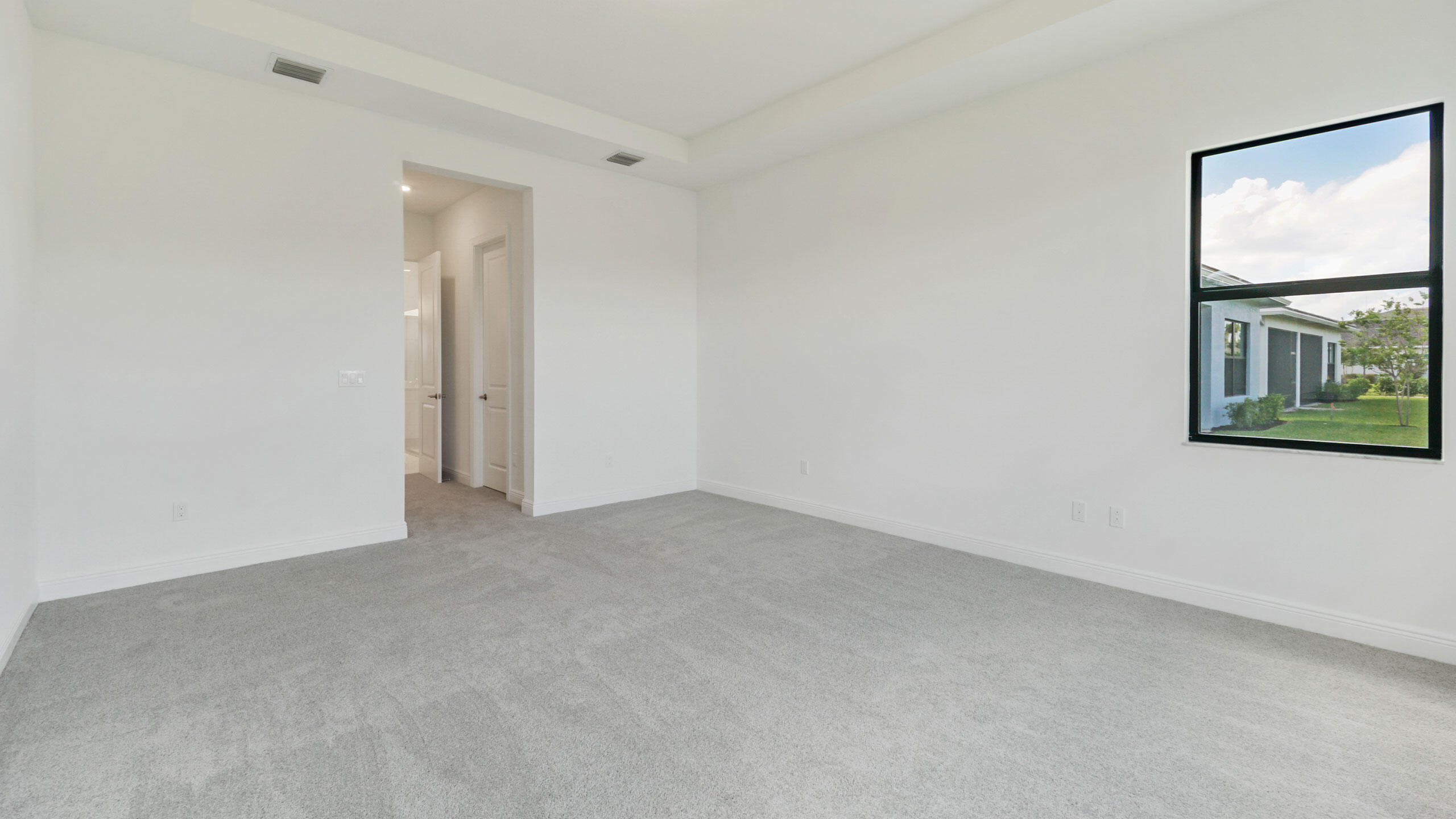 15739 Cresswind Place Westlake, FL 33470 - Photo 32 of 48 an empty room with windows and closet