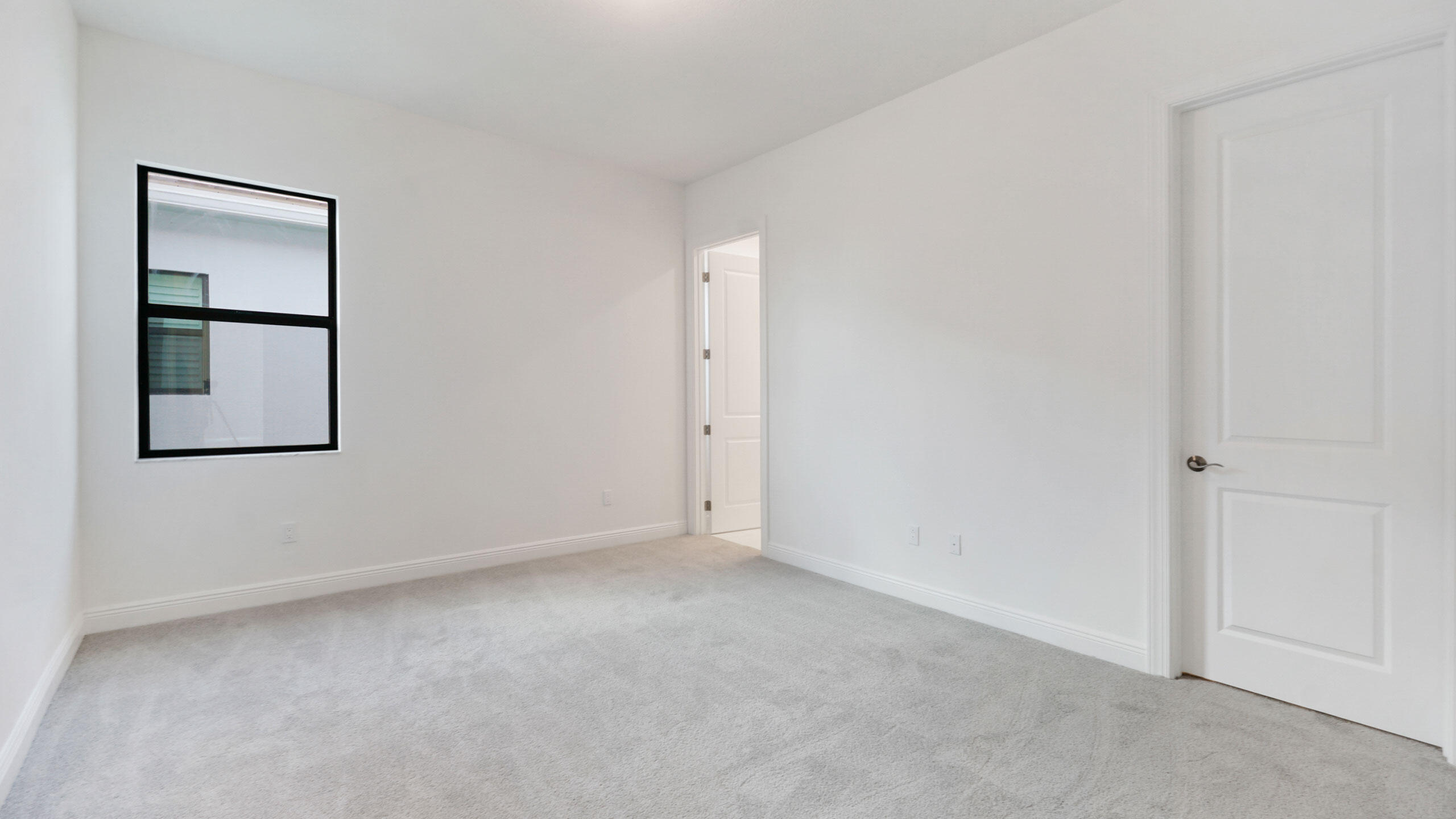 15739 Cresswind Place Westlake, FL 33470 - Photo 39 of 48 an empty room with windows and closet