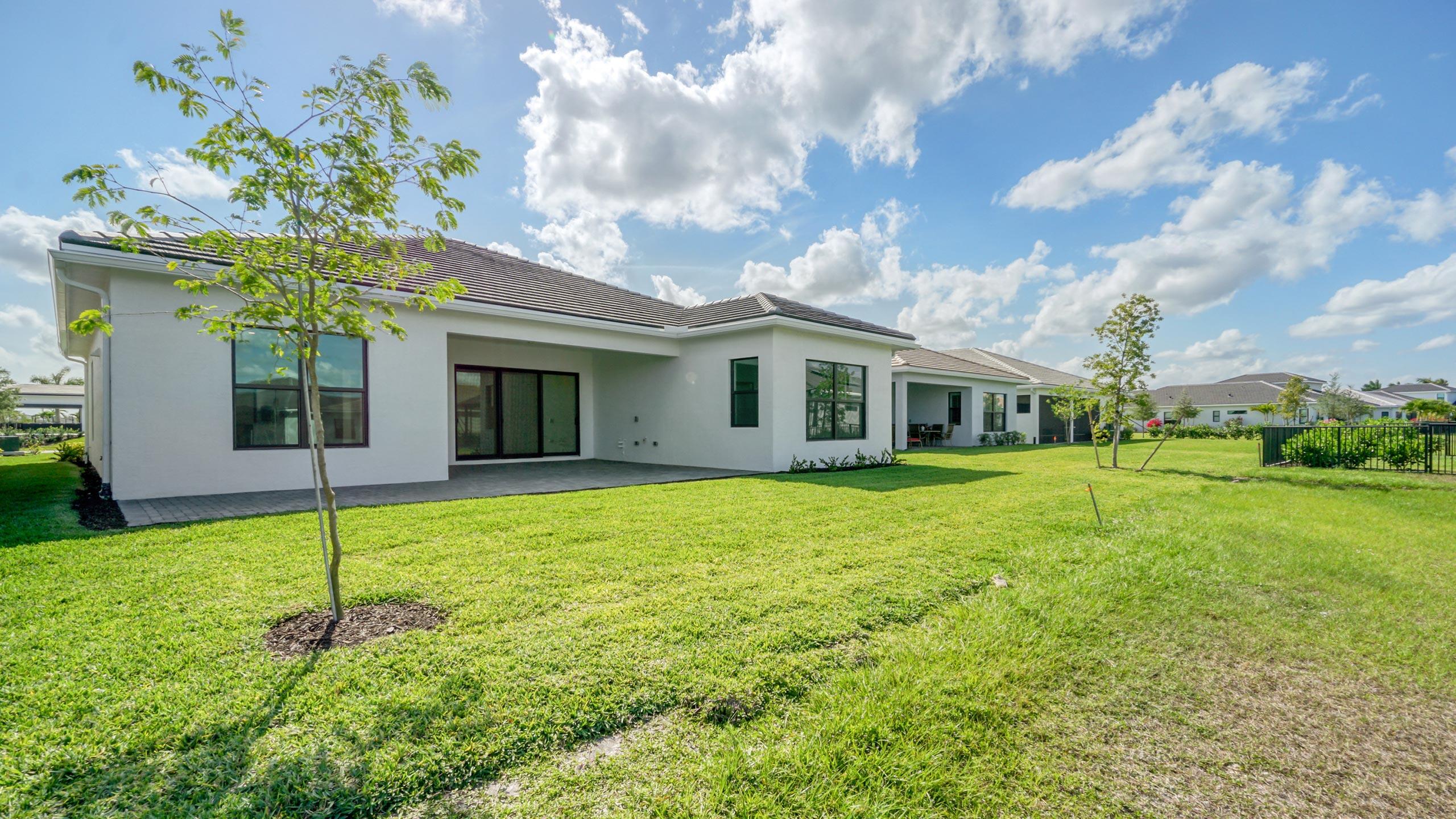 15739 Cresswind Place Westlake, FL 33470 - Photo 45 of 48 a house view with a garden space