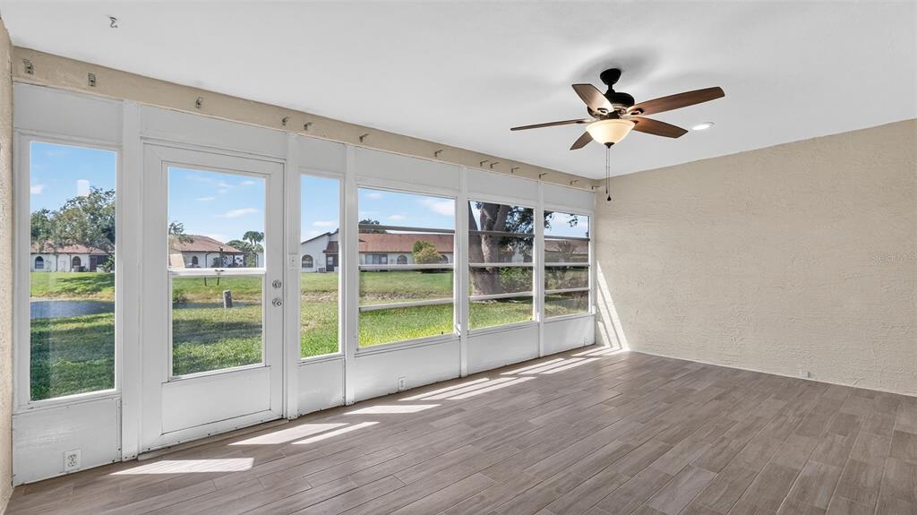 7280 Scotland Circle Weeki Wachee, FL 34613 - Photo 21 of 42 a view of a livingroom with a ceiling fan and window