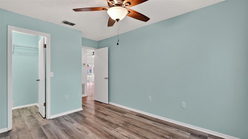 7280 Scotland Circle Weeki Wachee, FL 34613 - Photo 23 of 42 wooden floor in an empty room