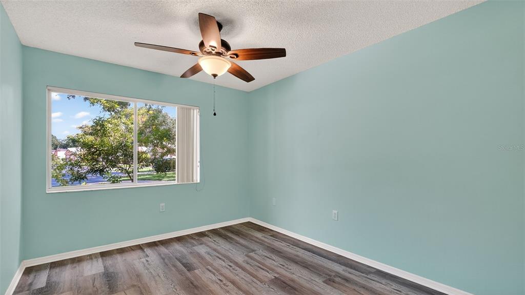 7280 Scotland Circle Weeki Wachee, FL 34613 - Photo 27 of 42 a view of room with window ceiling fan and a window